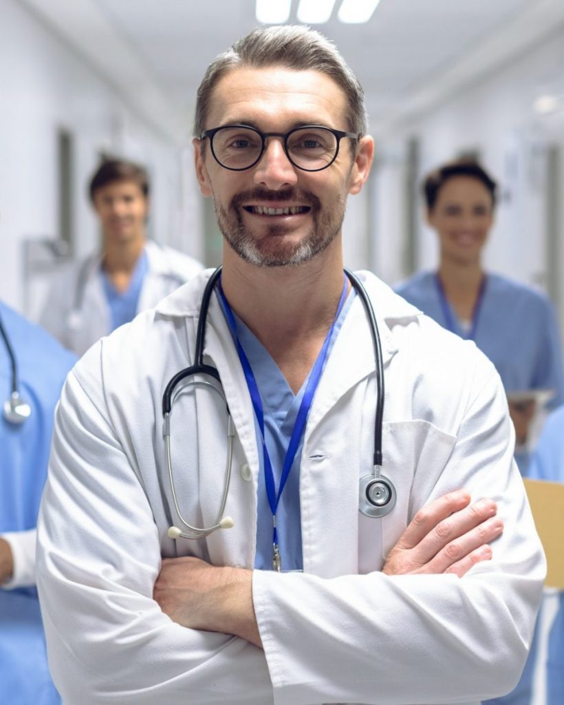 diverse-medical-team-of-doctors-looking-at-camera-while-holding-clipboard-and-medical-files-e1623252244361-pf2n5igpmfm4ppl9w5nt89pd7hae8a7fb8ryn904qo